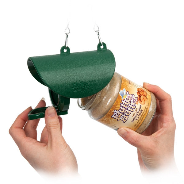 Inserting flutter peanut butter jar into the flutter butter feeder