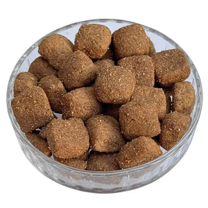 Clear glass bowl filled with fox food on a white background