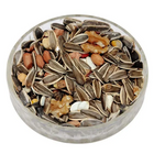 Assorted squirrel seed and nut mix in a clear glass bowl on a white background