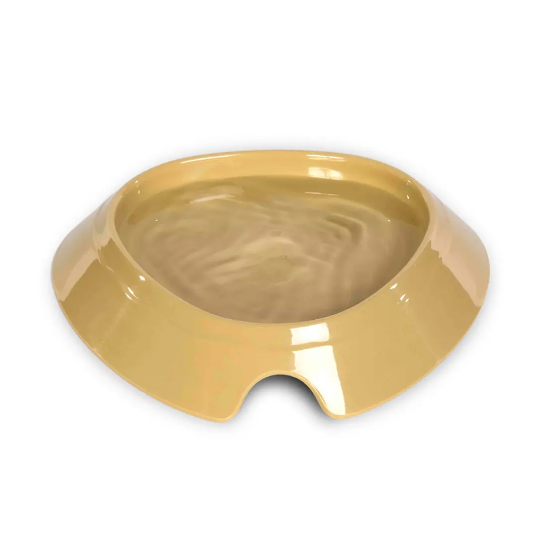 A glossy, shallow oval bowl wildlife water drinker in a warm tan  colour, shown on a plain white background.