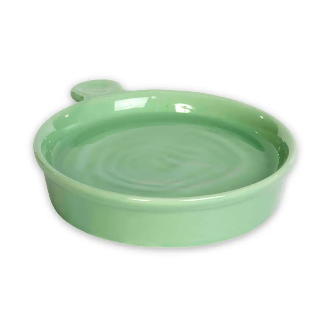 Green ceramic hedgehog bowl on a white background