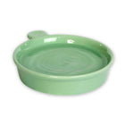 Green ceramic hedgehog bowl on a white background