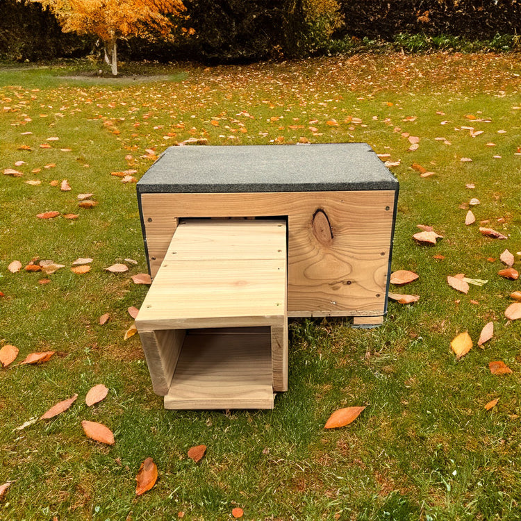 wooden hedgehog house in garden 