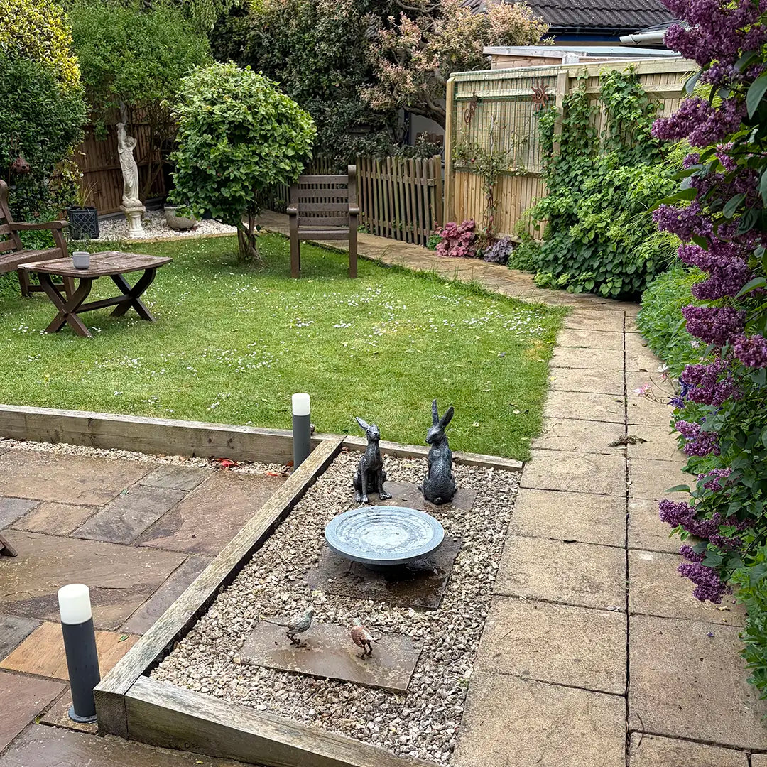 garden with a stepped wildlife drinker on patio area
