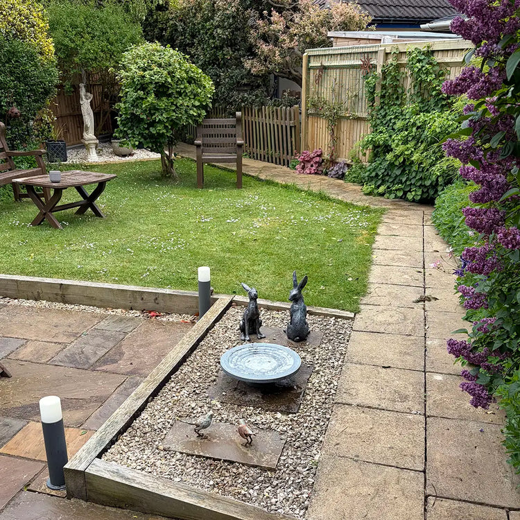 garden with a stepped wildlife drinker on patio area