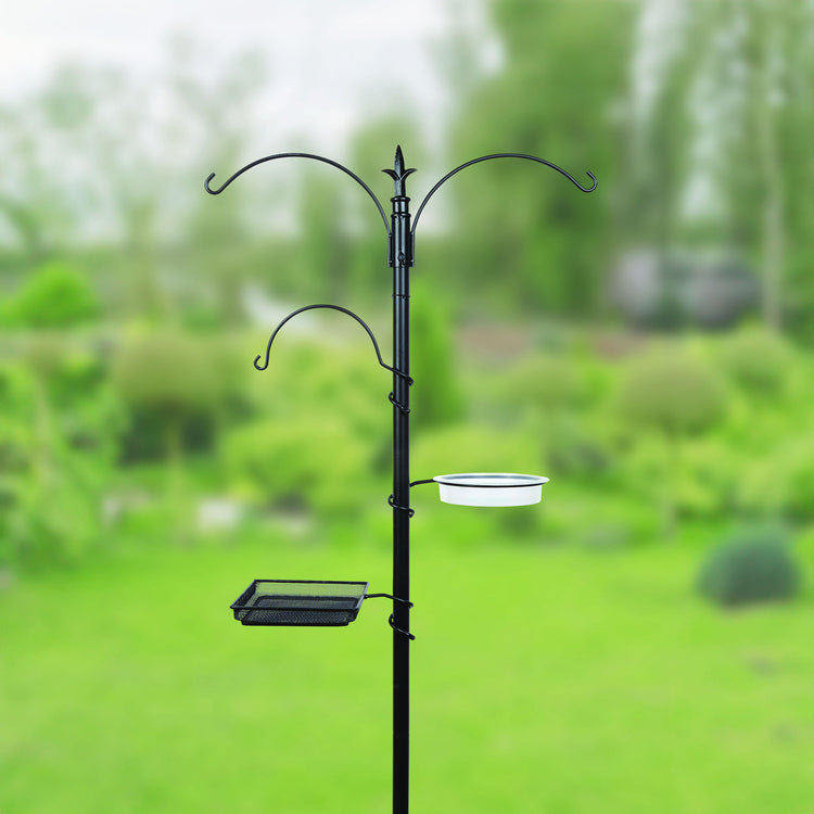 Bird Feeding Station with blurred garden background