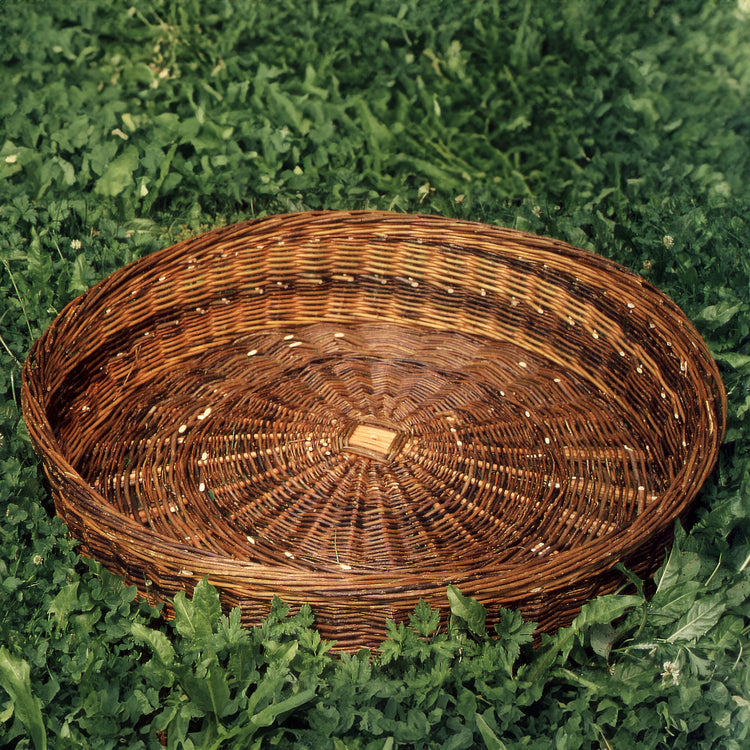 wicker nesting basket in the grass